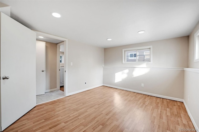 empty room with light hardwood / wood-style floors