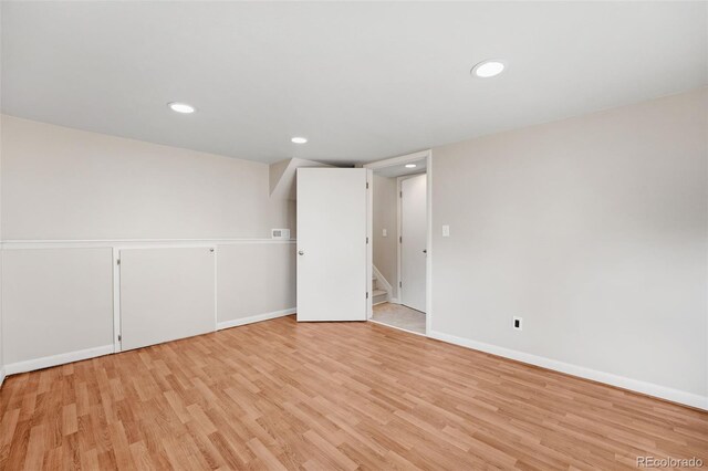 unfurnished room with light wood-type flooring