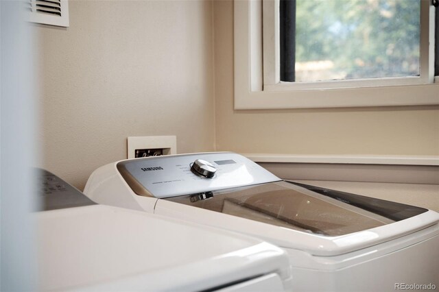 laundry area featuring separate washer and dryer