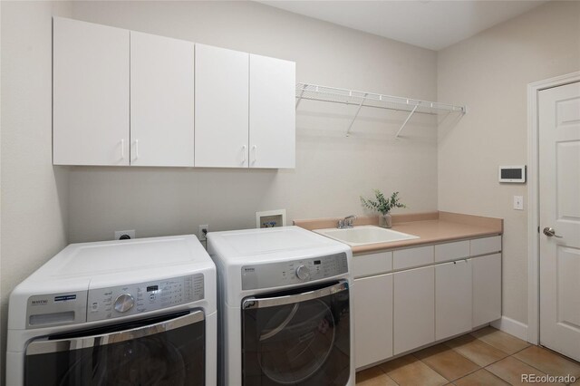 1996 Clipper Dr, Lafayette, CO 80026 - laundry room with separate washer and dryer, cabinet space, and light tile patterned floors