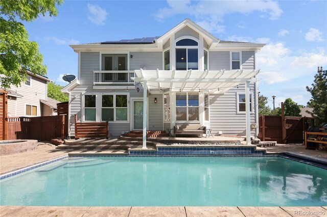 1996 Clipper Dr, Lafayette, CO 80026 - back of property featuring solar panels, a pergola, french doors, and fence