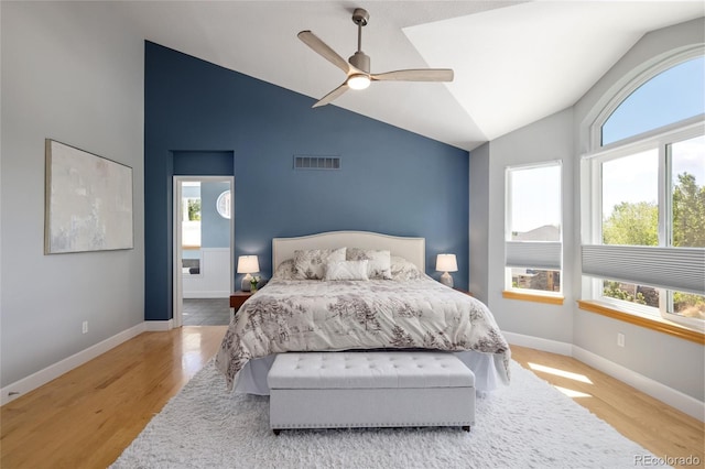 1996 Clipper Dr, Lafayette, CO 80026 - bedroom featuring multiple windows, vaulted ceiling, wood finished floors, baseboards, and a ceiling fan