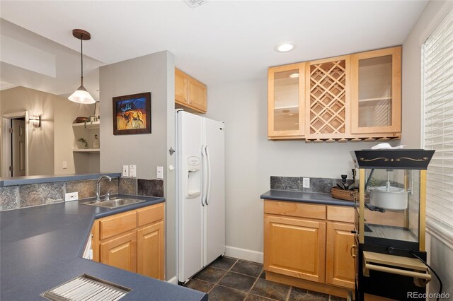 1996 Clipper Dr, Lafayette, CO 80026 - kitchen with white fridge with ice dispenser, a sink, dark countertops, glass insert cabinets, and recessed lighting