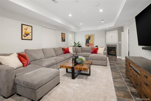 1996 Clipper Dr, Lafayette, CO 80026 - living area with recessed lighting, dark stone finish flooring, a raised ceiling, a fireplace, and baseboards