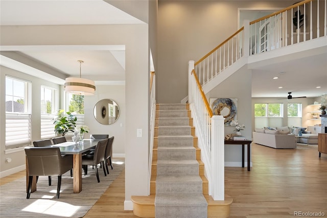 1996 Clipper Dr, Lafayette, CO 80026 - stairway featuring wood finished floors, baseboards, a ceiling fan, and recessed lighting
