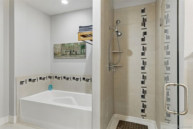 full bath featuring a bath, tile patterned floors, and a stall shower