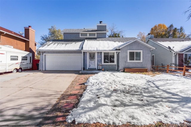 view of front of property with a garage