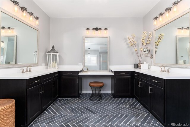 full bathroom featuring two vanities, a sink, and tile patterned flooring