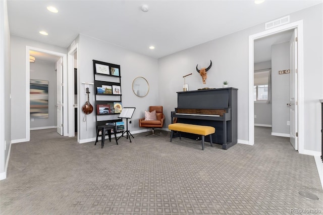 living area with recessed lighting, visible vents, baseboards, and carpet floors
