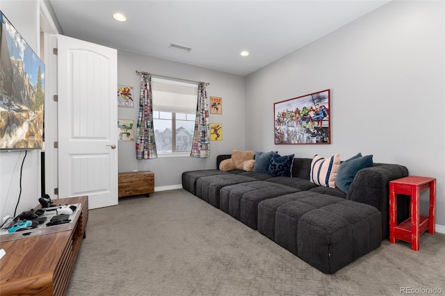 carpeted living room with recessed lighting, visible vents, and baseboards