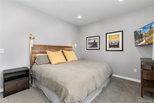 carpeted bedroom featuring baseboards and recessed lighting