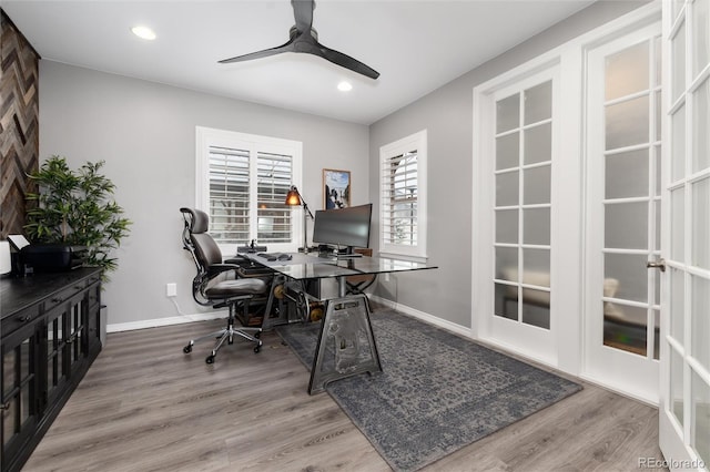 office space featuring baseboards, recessed lighting, wood finished floors, and a ceiling fan