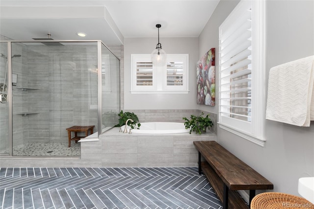 full bath featuring a shower stall, a bath, and tile patterned flooring