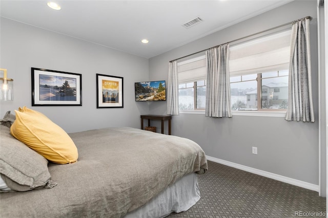 bedroom featuring visible vents, baseboards, recessed lighting, and carpet floors