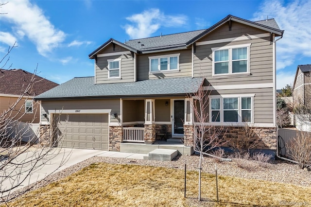 craftsman house with fence, driveway, covered porch, a shingled roof, and stone siding