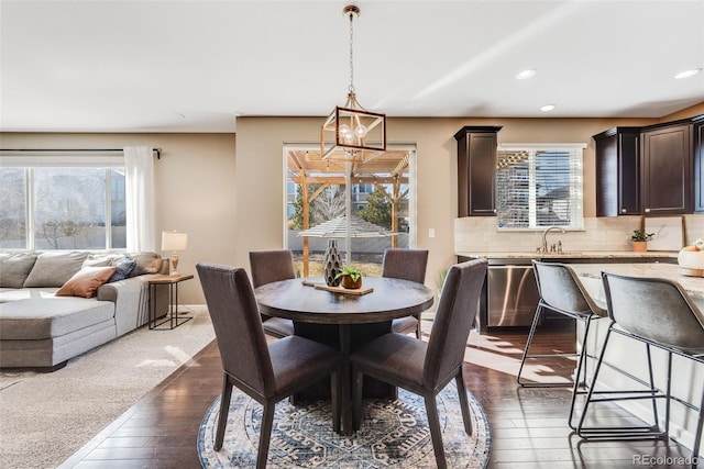 dining area featuring recessed lighting and dark wood-style flooring