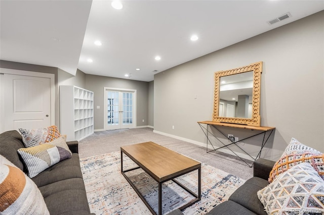 carpeted living room featuring recessed lighting, french doors, visible vents, and baseboards