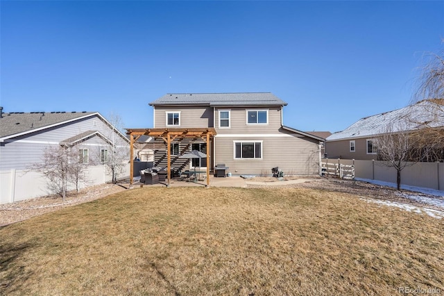 back of property with a yard, a patio, a pergola, and a fenced backyard