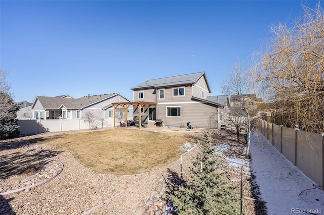 rear view of property with a yard, a patio, a fenced backyard, and a pergola