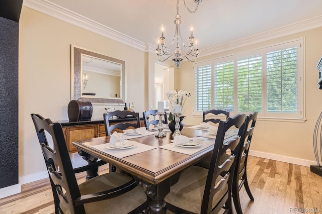 8657 Aberdeen Cir, Highlands Ranch, CO 80130 - dining space featuring a chandelier, crown molding, light wood-style floors, and baseboards