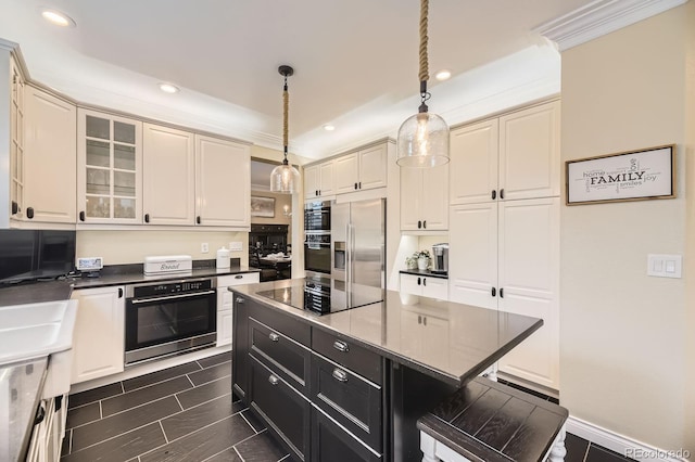 8657 Aberdeen Cir, Highlands Ranch, CO 80130 - kitchen with appliances with stainless steel finishes, dark cabinets, recessed lighting, dark countertops, and hanging light fixtures