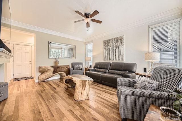 8657 Aberdeen Cir, Highlands Ranch, CO 80130 - living room with a ceiling fan, crown molding, light wood-style flooring, and baseboards