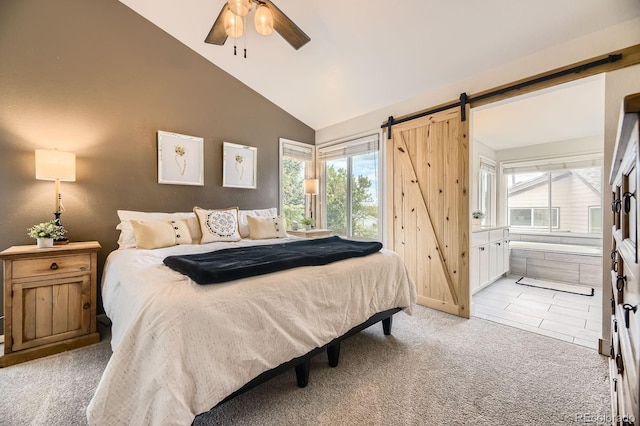 8657 Aberdeen Cir, Highlands Ranch, CO 80130 - bedroom with lofted ceiling, light colored carpet, a barn door, ensuite bathroom, and ceiling fan