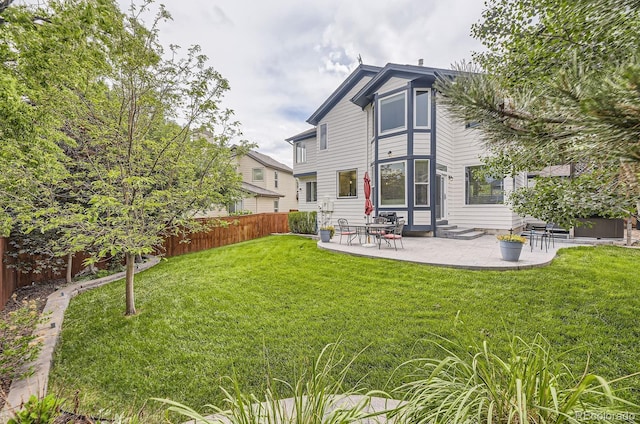 8657 Aberdeen Cir, Highlands Ranch, CO 80130 - rear view of house with a patio and entry steps