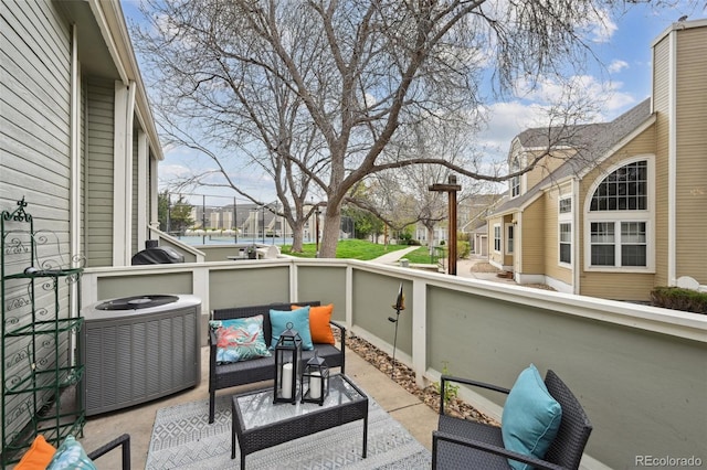 5875 W Asbury Pl, Lakewood, CO 80227 - exterior space with a residential view, central AC unit, and an outdoor hangout area