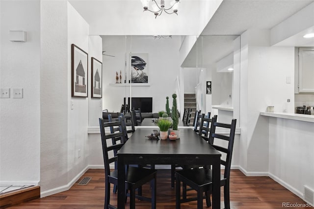 5875 W Asbury Pl, Lakewood, CO 80227 - dining space with dark wood-type flooring, baseboards, and visible vents