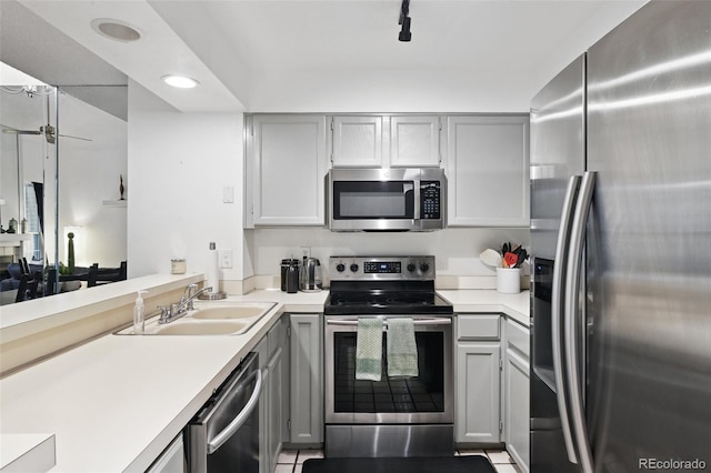 5875 W Asbury Pl, Lakewood, CO 80227 - kitchen featuring stainless steel appliances, gray cabinets, and a sink