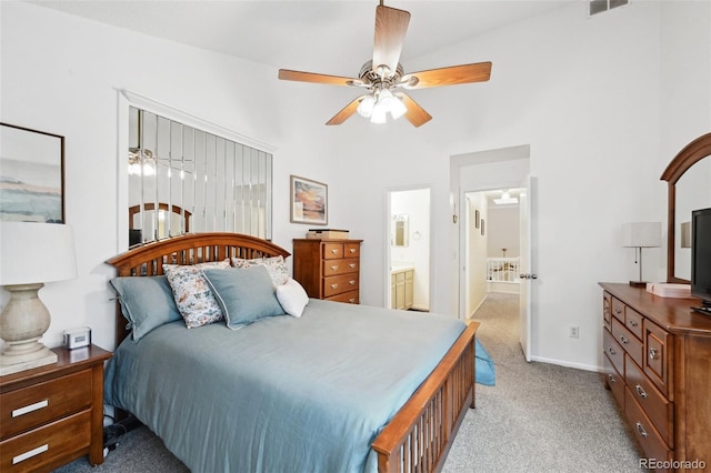 5875 W Asbury Pl, Lakewood, CO 80227 - bedroom featuring ceiling fan, carpet floors, baseboards, connected bathroom, and a high ceiling
