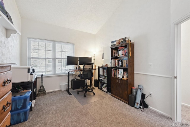 5875 W Asbury Pl, Lakewood, CO 80227 - carpeted home office with baseboards, vaulted ceiling, and visible vents
