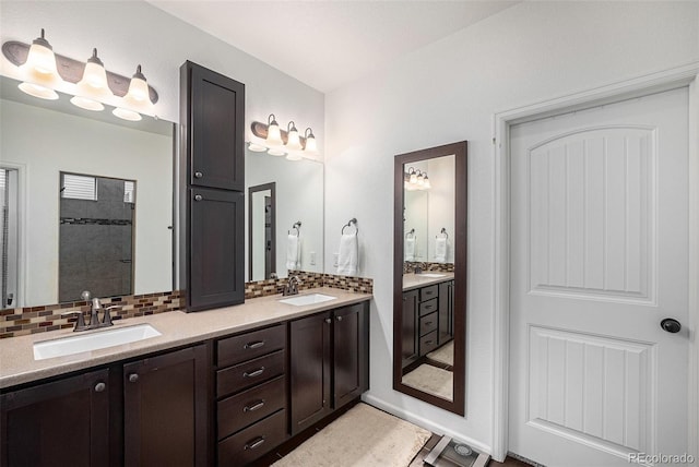 11511 E 118th Ave, Commerce City, CO 80640 - full bath featuring double vanity, tasteful backsplash, and a tile shower
