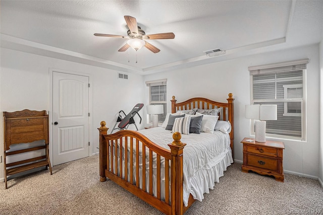11511 E 118th Ave, Commerce City, CO 80640 - carpeted bedroom featuring a tray ceiling, baseboards, and ceiling fan