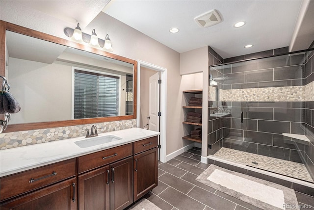11511 E 118th Ave, Commerce City, CO 80640 - bathroom featuring vanity, a shower stall, tile patterned flooring, recessed lighting, and baseboards