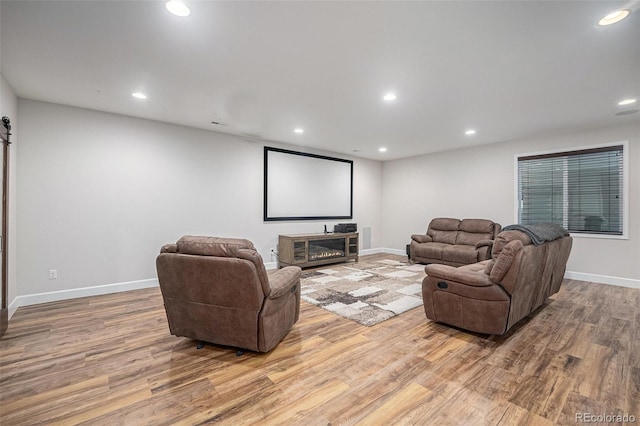 11511 E 118th Ave, Commerce City, CO 80640 - home theater featuring light wood-style floors, recessed lighting, and baseboards