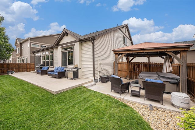 11511 E 118th Ave, Commerce City, CO 80640 - rear view of house with a hot tub, a gazebo, a patio, and outdoor lounge area