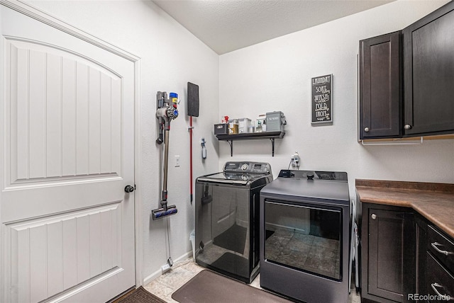 11511 E 118th Ave, Commerce City, CO 80640 - laundry area featuring cabinet space, separate washer and dryer, and baseboards