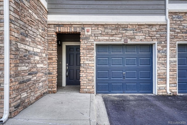 2943 W Riverwalk Cir Unit I, Littleton, CO 80123 - garage featuring driveway
