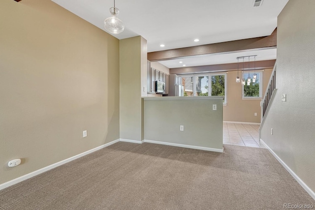 2943 W Riverwalk Cir Unit I, Littleton, CO 80123 - empty room featuring light carpet, stairs, and recessed lighting