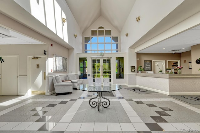 2943 W Riverwalk Cir Unit I, Littleton, CO 80123 - living area with inlaid floor details, french doors, and a high ceiling