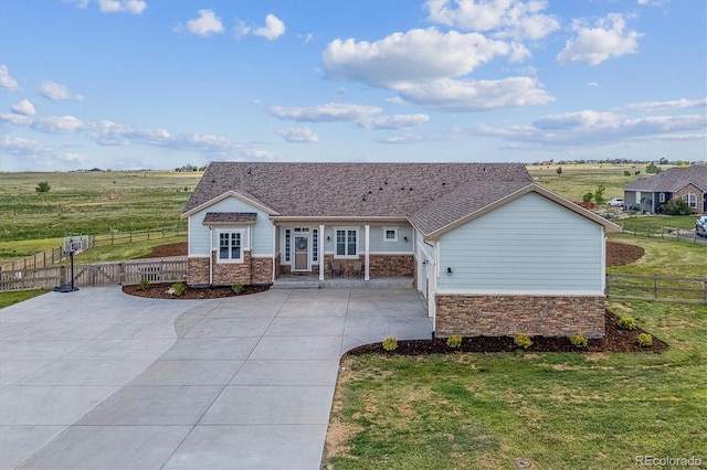 527 Antelope Dr E, Bennett, CO 80102 - ranch-style house with stone siding and driveway