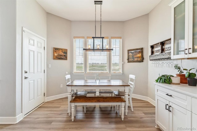527 Antelope Dr E, Bennett, CO 80102 - dining area with light wood finished floors and baseboards