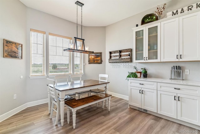 527 Antelope Dr E, Bennett, CO 80102 - dining room featuring light wood-style floors and baseboards