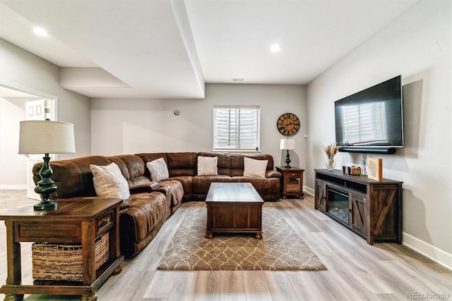 527 Antelope Dr E, Bennett, CO 80102 - living room with wood finished floors, baseboards, and recessed lighting