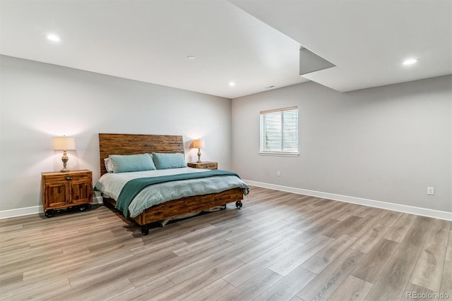 527 Antelope Dr E, Bennett, CO 80102 - bedroom with light wood-type flooring, baseboards, and recessed lighting