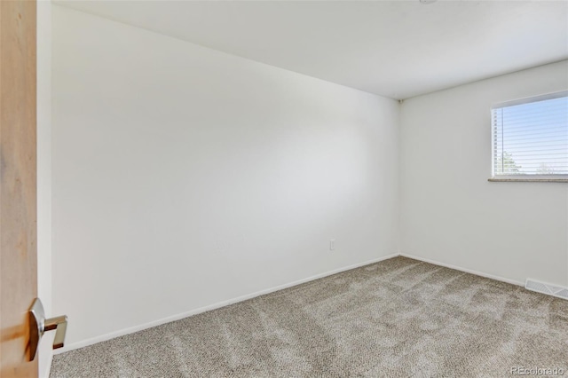 11310 W Center Ave, Lakewood, CO 80226 - spare room featuring carpet and baseboards