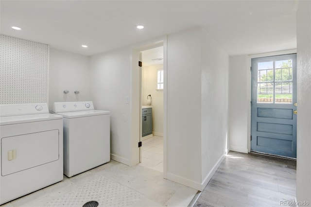 11310 W Center Ave, Lakewood, CO 80226 - clothes washing area featuring washer and clothes dryer, healthy amount of natural light, recessed lighting, and baseboards