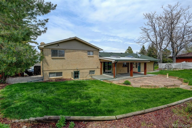 11310 W Center Ave, Lakewood, CO 80226 - back of house with a patio and brick siding